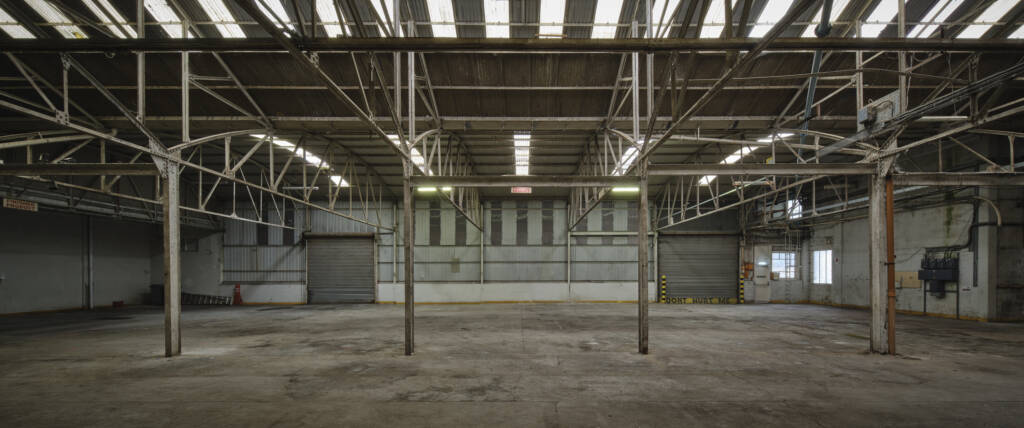 Interior shot of Dublin port showing an empty warehouse with grey metal supports